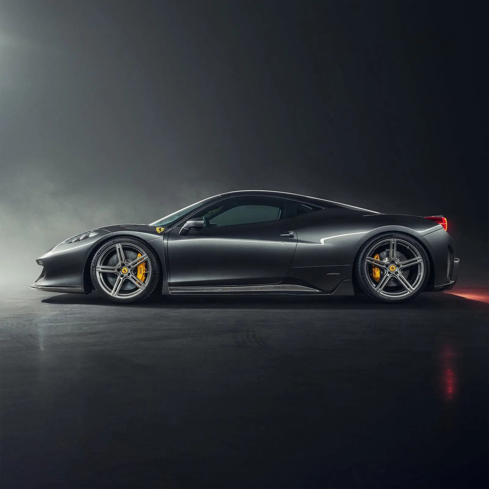 Black Ferrari 458 on Vorsteiner forged wheels in a dark studio