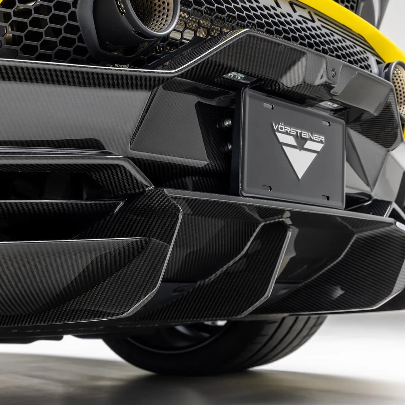 Carbon-fiber rear diffuser detail on a Vorsteiner Lamborghini Huracán STO